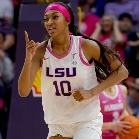 Angel Reese celebrates a score during the second half against Alabama.