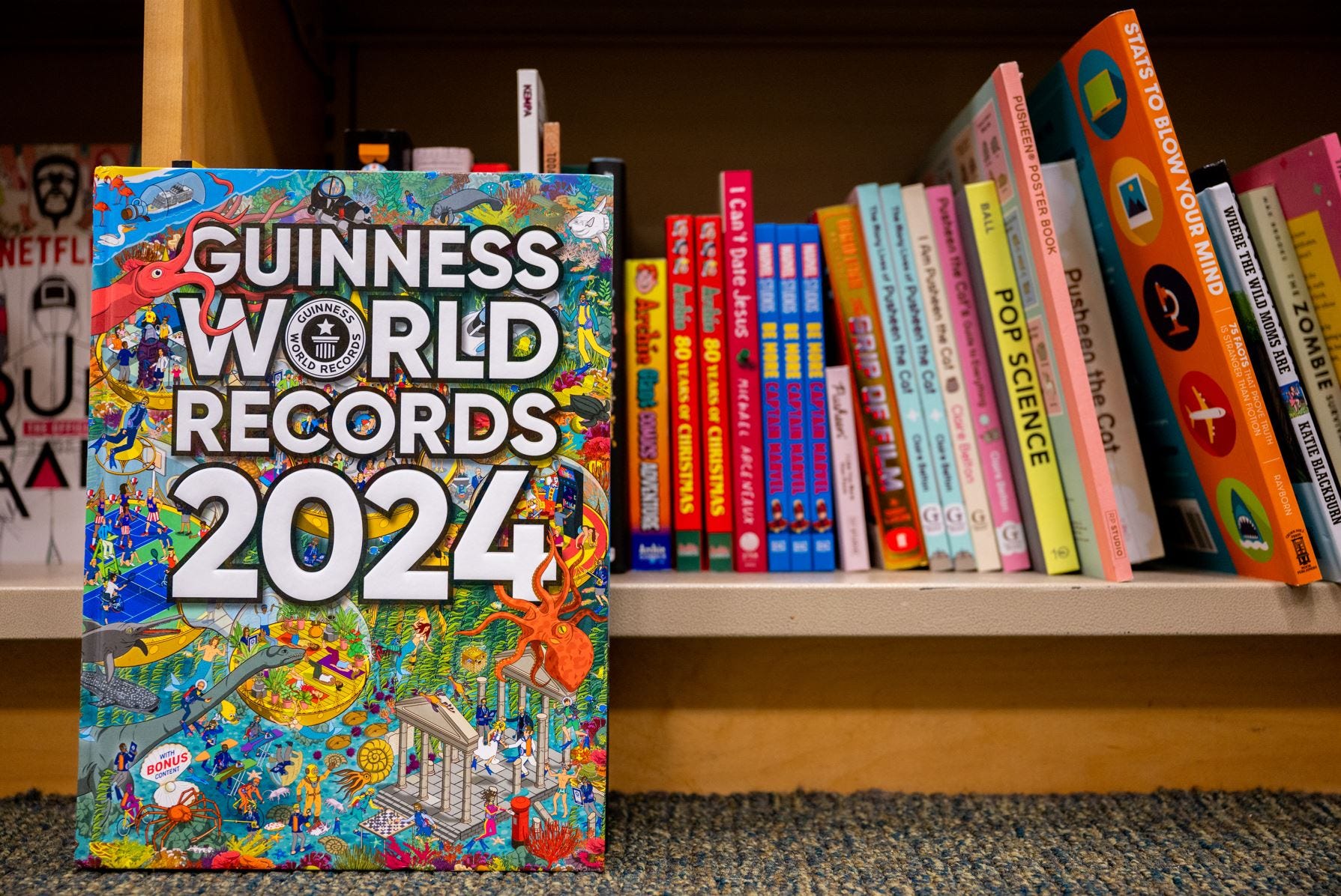 In a photo illustration, a 'Guinness World Records 2024' book is seen placed on a floor at a Barnes & Noble store on January 11, 2024 in Austin, Texas.