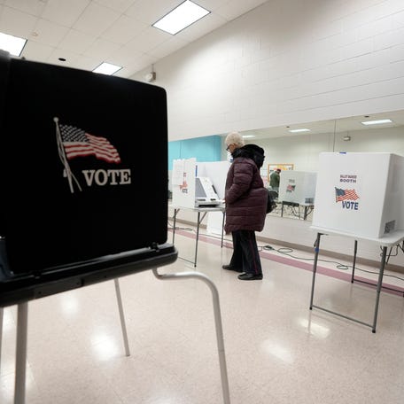 March 19, 2024; Columbus, Ohio, USA;   A woman votes at Blackburn Recreation Center on Election Day on Tuesday.