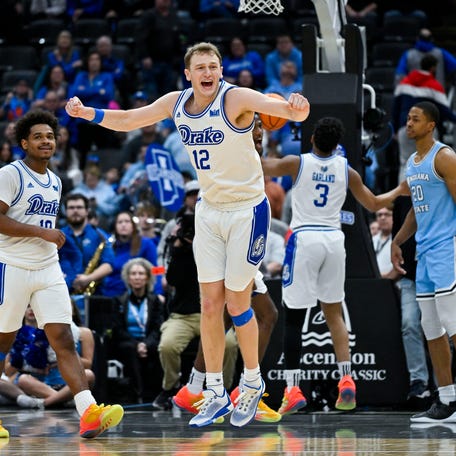 Drake Bulldogs guard Tucker DeVries (12) reacts after Drake defeated the Indiana State Sycamores to win the Missouri Valley Conference Tournament Championship at Enterprise Center.