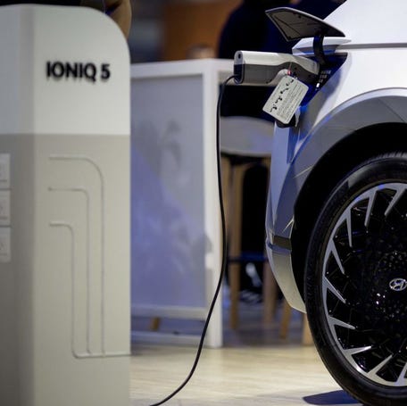 A Hyundai Ioniq 5 is pictured plugged in to a charging station at the 44th Bangkok International Motor Show in Bangkok on March 22, 2023. (Photo by Jack TAYLOR / AFP) (Photo by JACK TAYLOR/AFP via Getty Images)