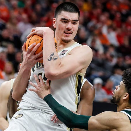 Purdue center Zach Edey (15) grabs a rebound against Michigan State forward Malik Hall (25) during the second half of quarterfinal of Big Ten tournament at Target Center in Minneapolis, Minn. on Friday, March 15, 2024.