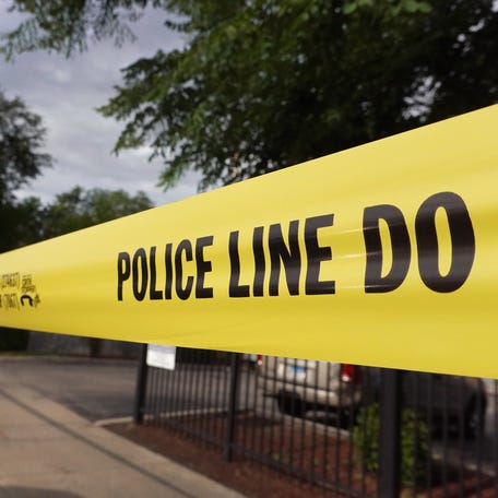 Police tape surrounds a crime scene where three people were shot at the Wentworth Gardens housing complex in the Bridgeport neighborhood on June 23, 2021 in Chicago.