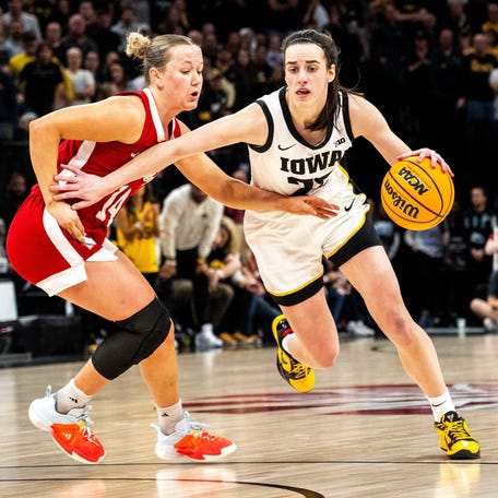 Iowa guard Caitlin Clark (22) drives to the basket against Nebraska guard Callin Hake during the Big Ten Tournament championship game at the Target Center on Sunday, March 10, 2024, in Minneapolis, Minn.