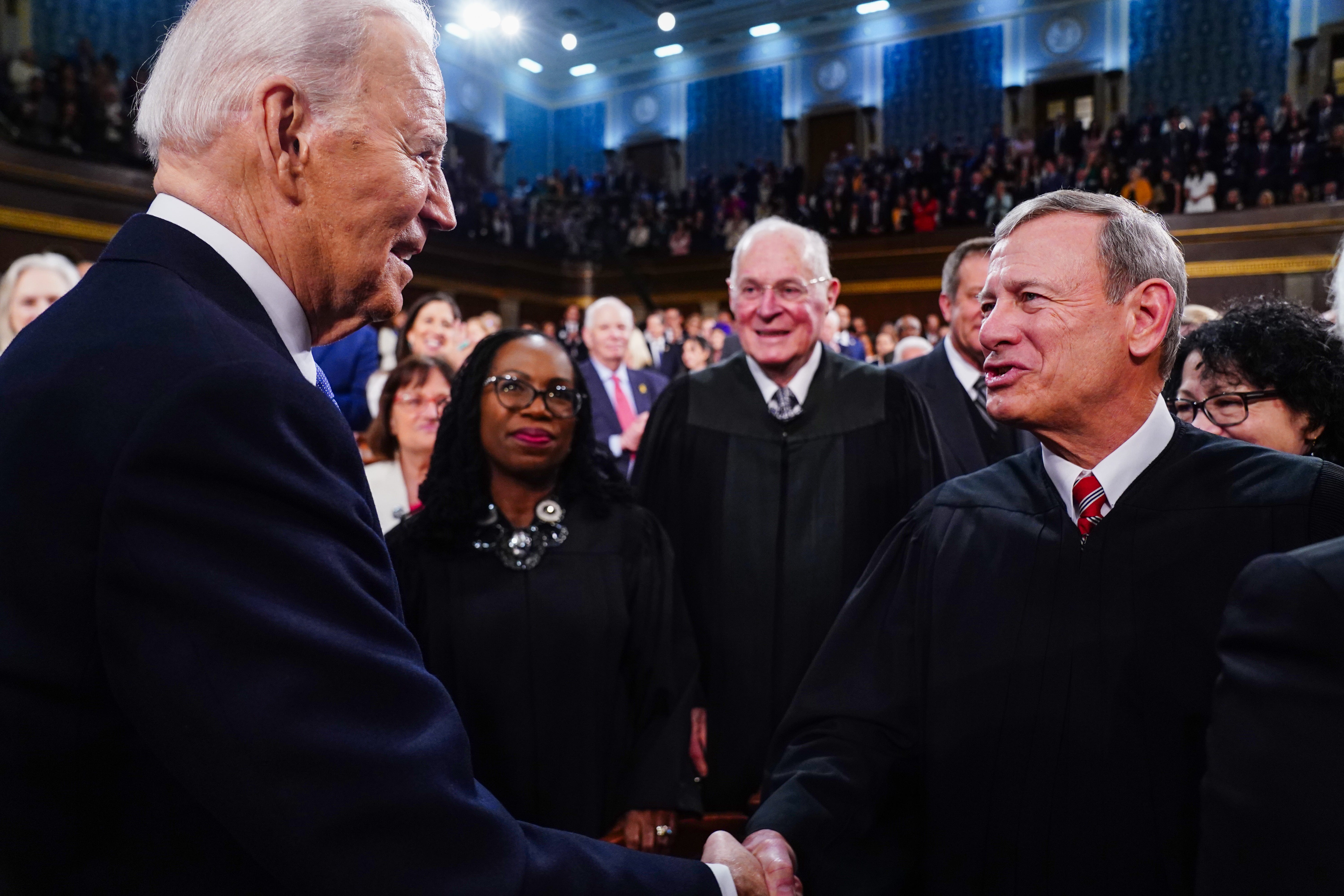 Mar 7, 2024; Washington, DC, USA; US President Joe Biden (L) greets Chief Justice of the Supreme Court John Roberts (R) as he arrives to the House Chamber of the US Capitol for his third State of the Union address to a joint session of Congress at the U.S. Capitol in Washington on March 7, 2024. Mandatory Credit: Shawn Thew/Pool via USA TODAY ORG XMIT: USAT-746164 ORIG FILE ID: 20240307_so6_nbr_151.JPG