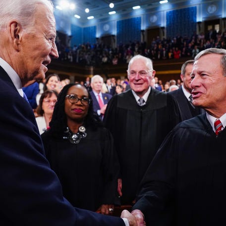 Mar 7, 2024; Washington, DC, USA; US President Joe Biden (L) greets Chief Justice of the Supreme Court John Roberts (R) as he arrives to the House Chamber of the US Capitol for his third State of the Union address to a joint session of Congress at the U.S. Capitol in Washington on March 7, 2024. Mandatory Credit: Shawn Thew/Pool via USA TODAY ORG XMIT: USAT-746164 ORIG FILE ID: 20240307_so6_nbr_151.JPG