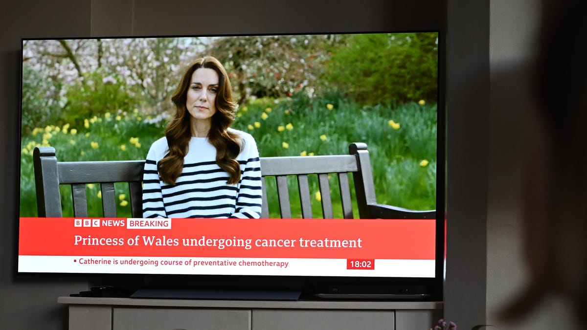 A relative of the photographer watches television, as Catherine, The Princess of Wales announces that she is receiving a preventitive course of chemotherapy for cancer on March 22, 2024 in London, England. The Princess of Wales had abdominal surgery earlier this year and has revealed that cancer has subsequently been found. She said she has been receiving chemotherapy and asked for privacy for her and her family.