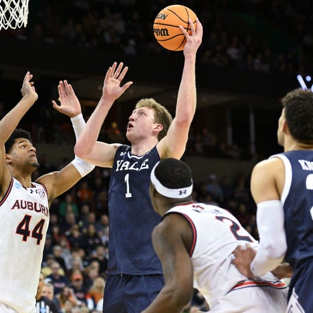 Yale forward Danny Wolf (1) attempts a basket against Auburn center Dylan Cardwell (44) during the first round of the 2024 NCAA men's tournament at Spokane Veterans Memorial Arena.