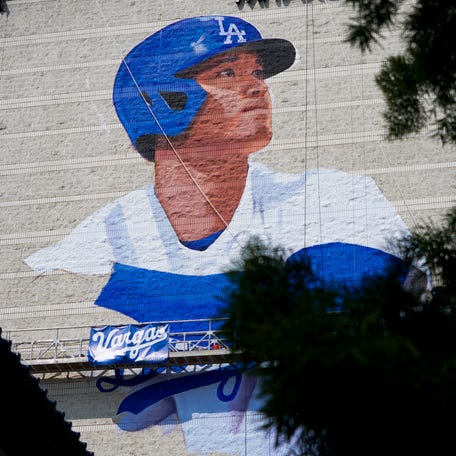 Artist Robert Vargas works on a mural of Shohei Ohtani. The 150 foot by 60 foot mural is on the east wall of the 11-story Miyako Hotel in the Little Tokyo District of Los Angeles. The mural will be officially unveiled on March 27, the day before the Dodgers play their first home game of the 2024 season.