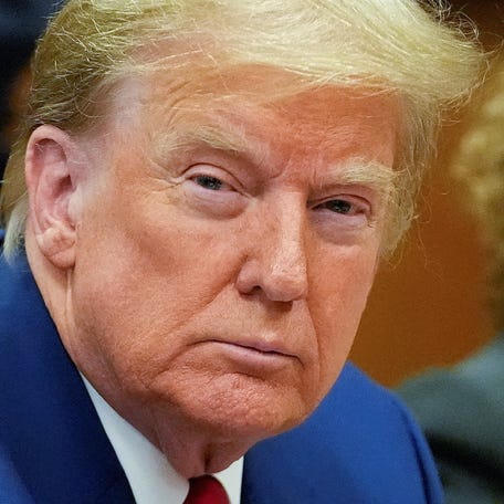 Former U.S. President Donald Trump awaits the start of a pre-trial hearing, on charges stemming from hush money paid to a porn star, in New York City, U.S., March 25, 2024.