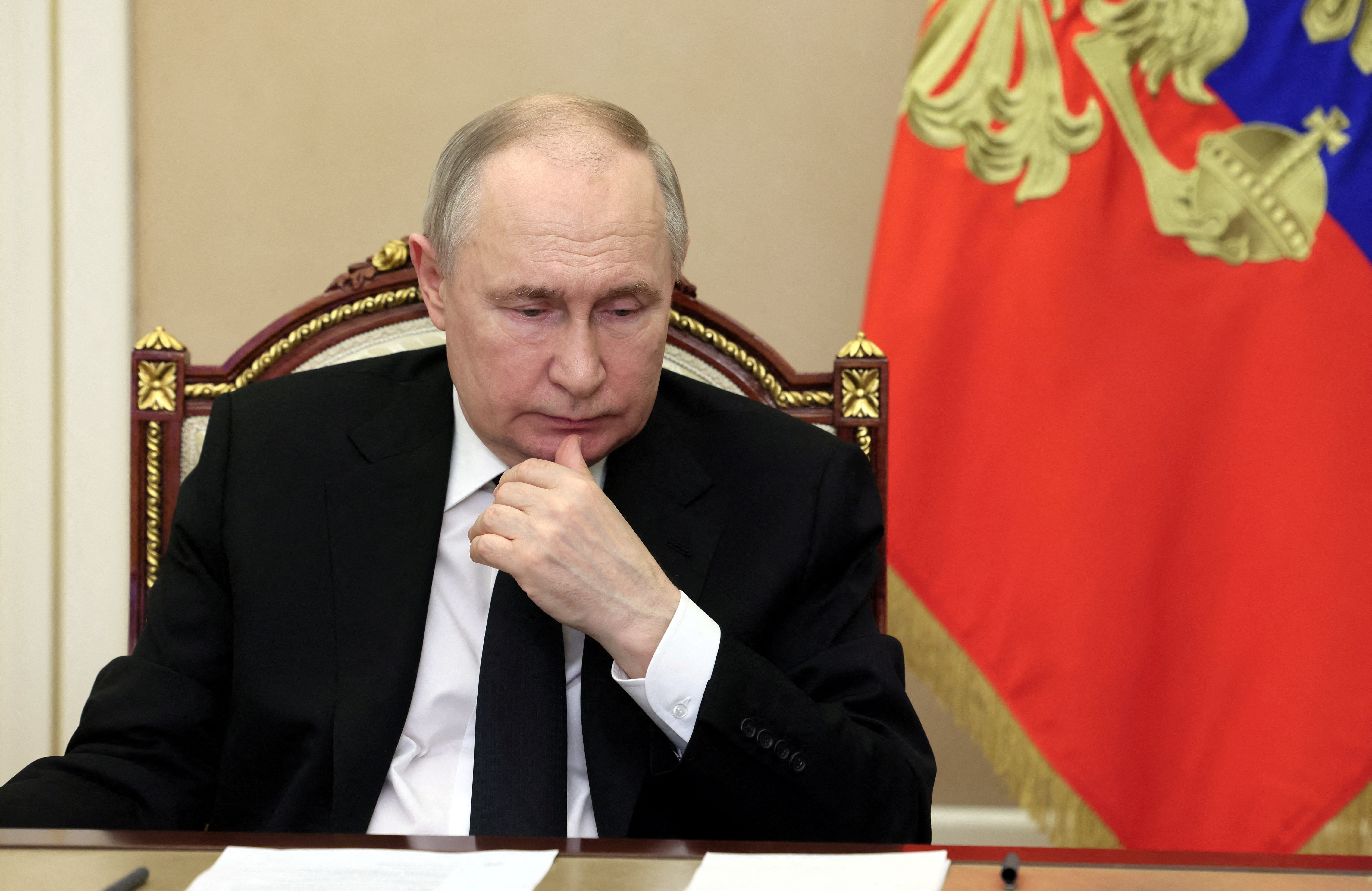 Russian President Vladimir Putin chairs a meeting, held via video link, to discuss aftermaths and measures taken after the Friday attack on the Crocus City Hall concert venue, outside Moscow, Russia, March 25, 2024.