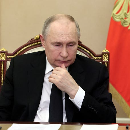 Russian President Vladimir Putin chairs a meeting, held via video link, to discuss aftermaths and measures taken after the Friday attack on the Crocus City Hall concert venue, outside Moscow, Russia, March 25, 2024.