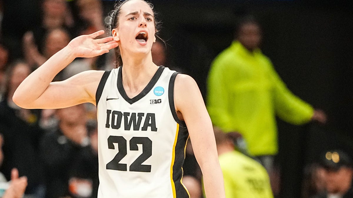Caitlin Clark celebrates during the final seconds of Iowa's second-round NCAA Tournament win over West Virginia.