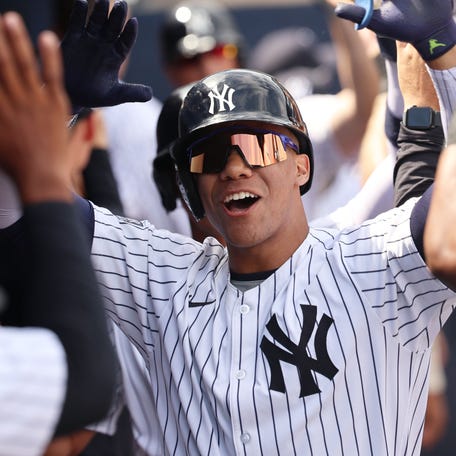 Mar 10, 2024; Tampa, Florida, USA; New York Yankees left fielder Juan Soto (22) is congratulated after hitting a three run home run during the fourth inning against the Atlanta Braves at George M. Steinbrenner Field. Mandatory Credit: Kim Klement Neitzel-USA TODAY Sports