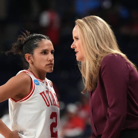 Utah coach Lynn Roberts (right) talks with guard Ines Vieira (2) during the game against South Dakota State at McCarthey Athletic Center.