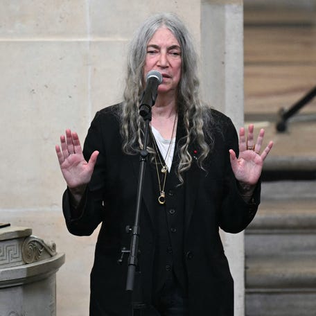 Patti Smith performs during the induction ceremony into the institution of the US photographer Annie Leibovitz at the Institut de France in Paris, on March 20, 2024.