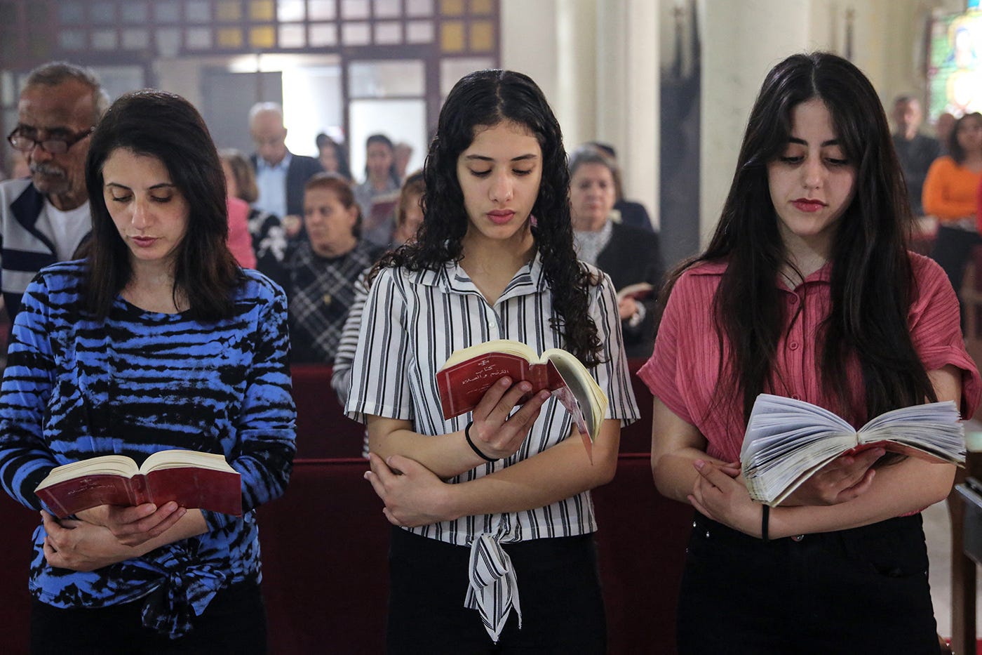 Palestinian Christians celebrate Easter Sunday Mass at the Catholic Holy Family Church in Gaza City, on March 31, 2024, amid the ongoing battles Israel and the Hamas militant group.