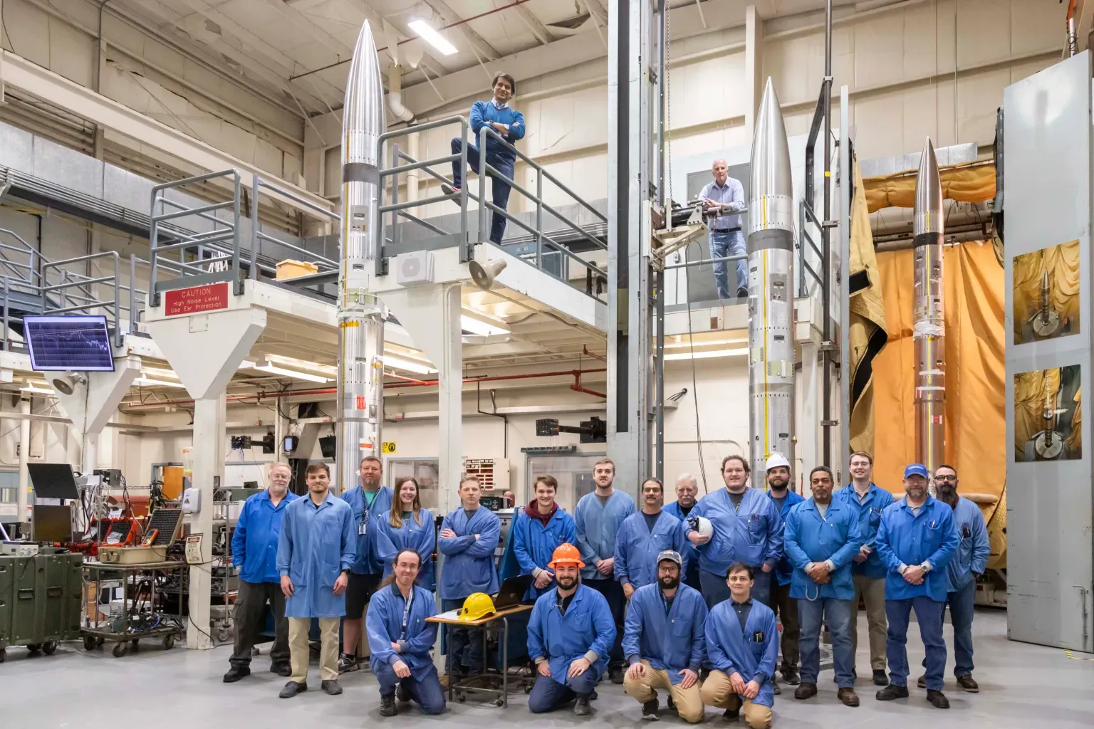 The three sounding rockets can be in this photo shortly after the pictured support team successfully assembled them. NASA is launching the rockets April 8 during the solar eclipse to study how the sudden drop in sunlight affects our upper atmosphere.