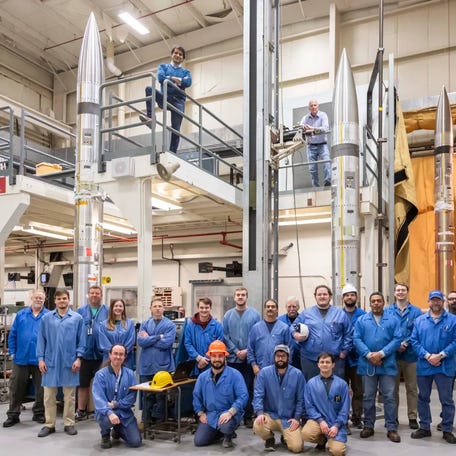The three sounding rockets can be in this photo shortly after the pictured support team successfully assembled them. NASA is launching the rockets April 8 during the solar eclipse to study how the sudden drop in sunlight affects our upper atmosphere.