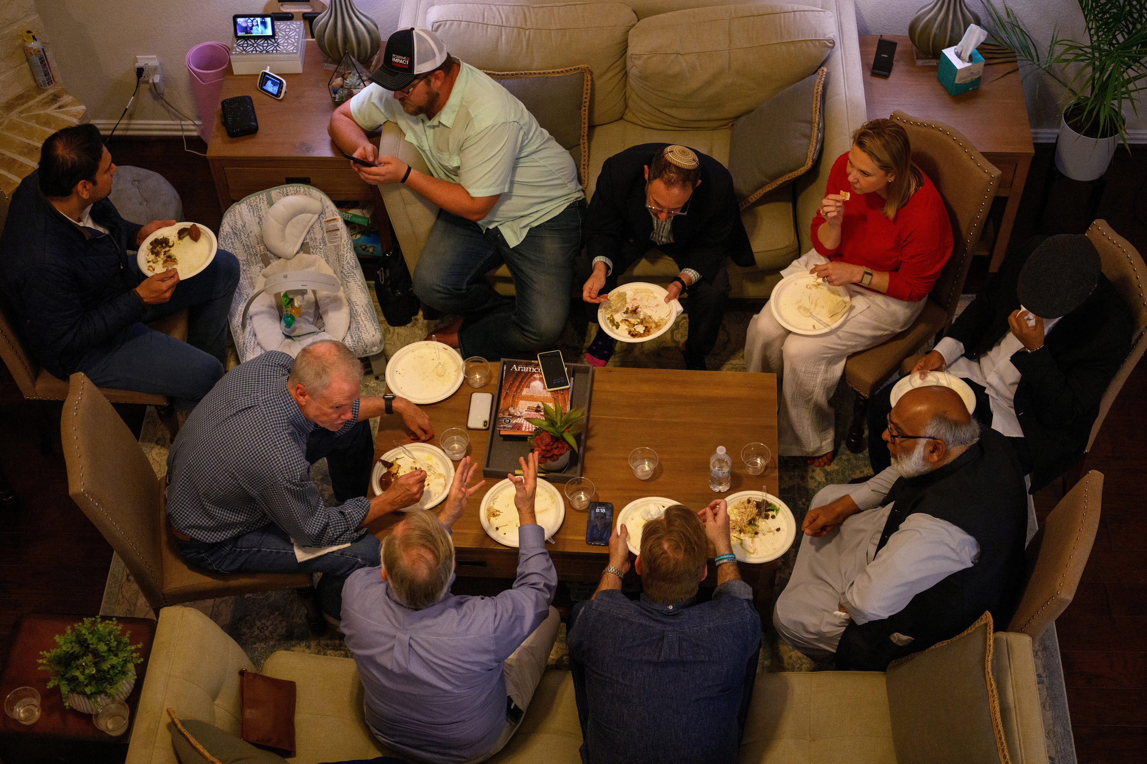 As the current Israel-Hamas conflict nears the six-month mark, friends of different faiths gather for iftar at the home of Shariq Ghani in Richmond, Texas, on April 2, 2024.