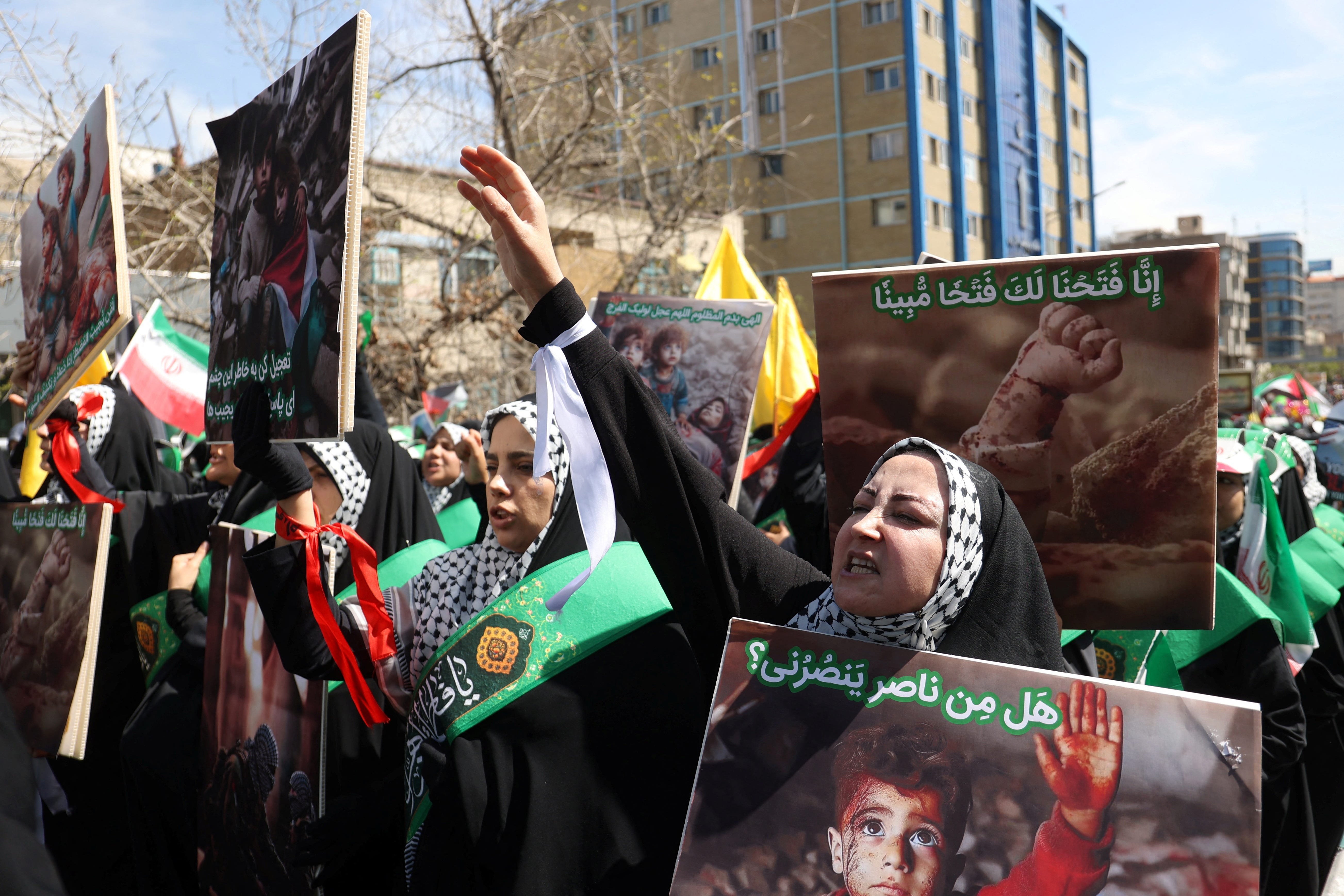Iranians attend a rally marking Quds Day and the funeral of members of the Islamic Revolutionary Guard Corps who were killed in a suspected Israeli airstrike on the Iranian embassy complex in Damascus, in Tehran, Iran, April 5, 2024.