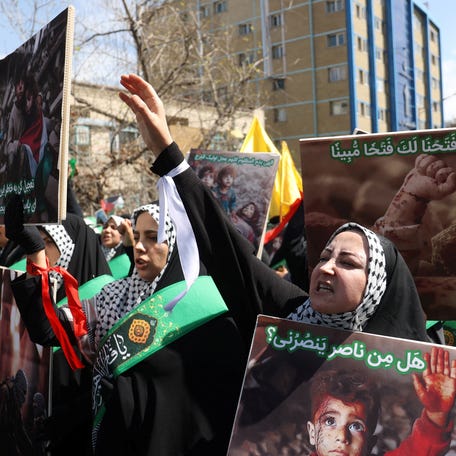 Iranians attend a rally marking Quds Day and the funeral of members of the Islamic Revolutionary Guard Corps who were killed in a suspected Israeli airstrike on the Iranian embassy complex in Damascus, in Tehran, Iran, April 5, 2024.