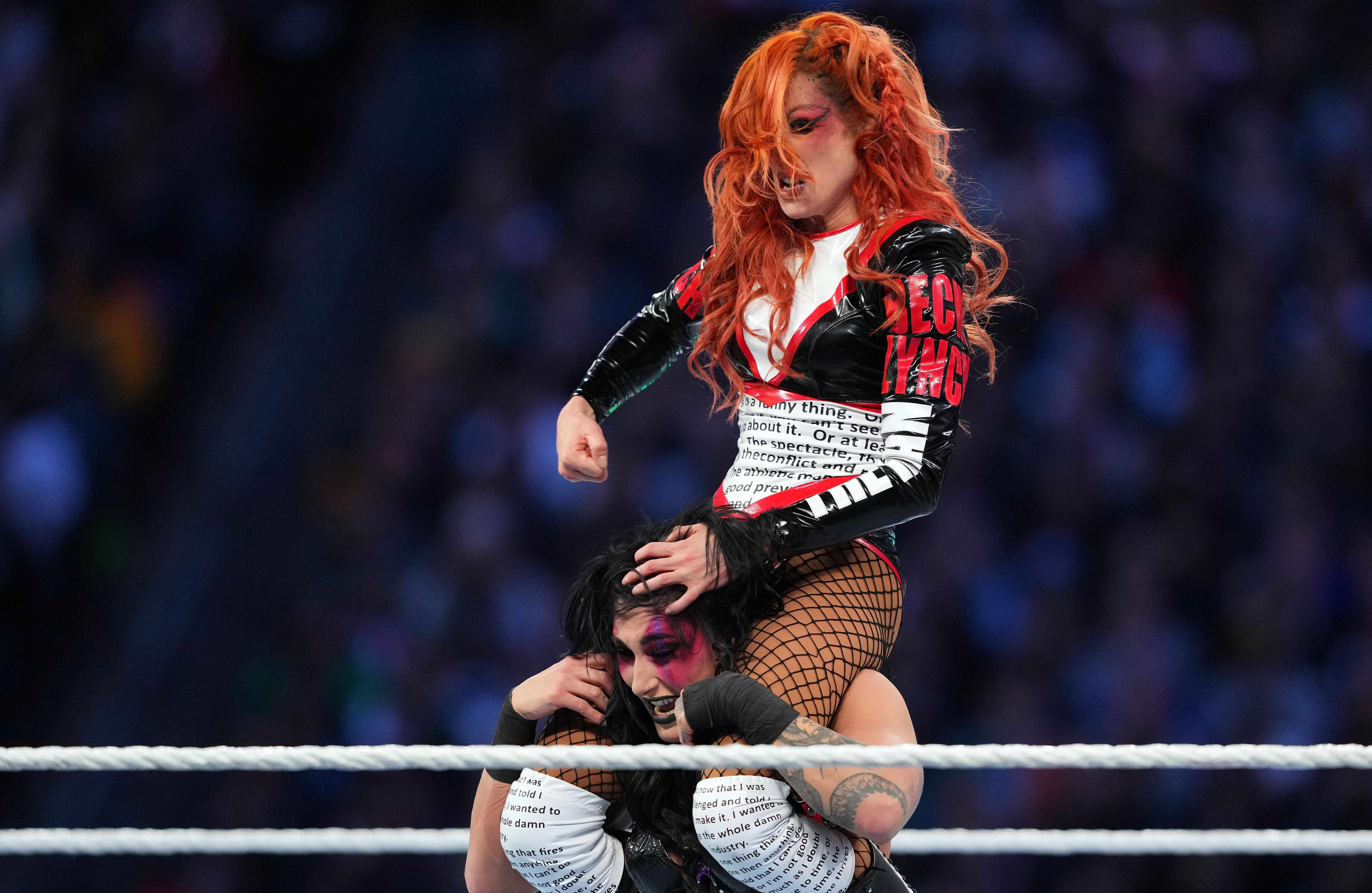 Rhea Ripley (black attire) and Becky Lynch (red/white attire) during Wrestlemania XL Saturday at Lincoln Financial Field.