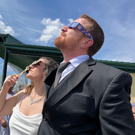 Local couple Samantha Palmer and Gerald Lester are minutes away from tying the knot at Trenton's Solar Eclipse Mass Wedding Ceremony officiated by Mayor Ryan Perry.