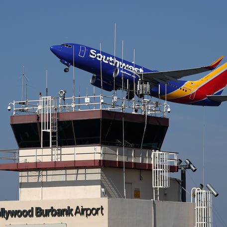 BURBANK, CALIFORNIA - SEPTEMBER 25: A Southwest Airlines take off past the control tower at Burbank Hollywood Airport on September 25, 2023 in Burbank, California. Transportation Secretary Pete Buttigieg is warning that vital training for new air traffic controllers would be paused if the government shuts down later this week. The Department of Transportation currently has 2,600 much needed air traffic controllers undergoing training and employs 1,200   fewer certified controllers than that agency did 10 years ago. (Photo by Justin Sullivan/Getty Images)
