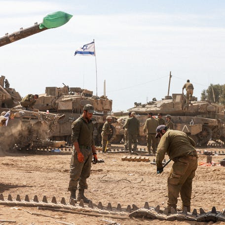Israeli soldiers prepare their tanks in an army camp near Israel's border with the Gaza Strip on April 8, 2024, amid the ongoing conflict between Israel and the militant group Hamas.