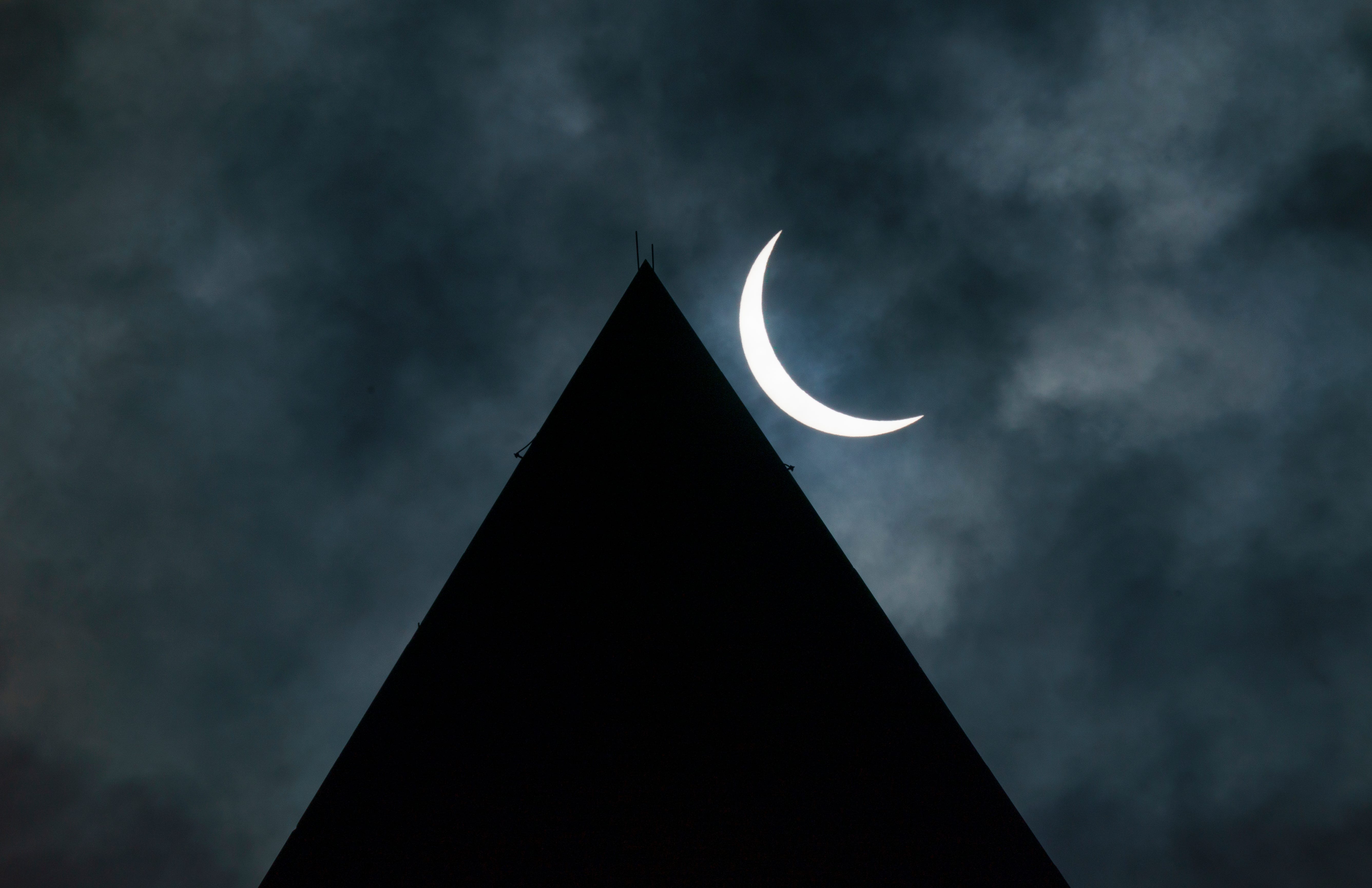 Partial eclipse over the Washington Monument is seen on Monday, April 8, 2024.