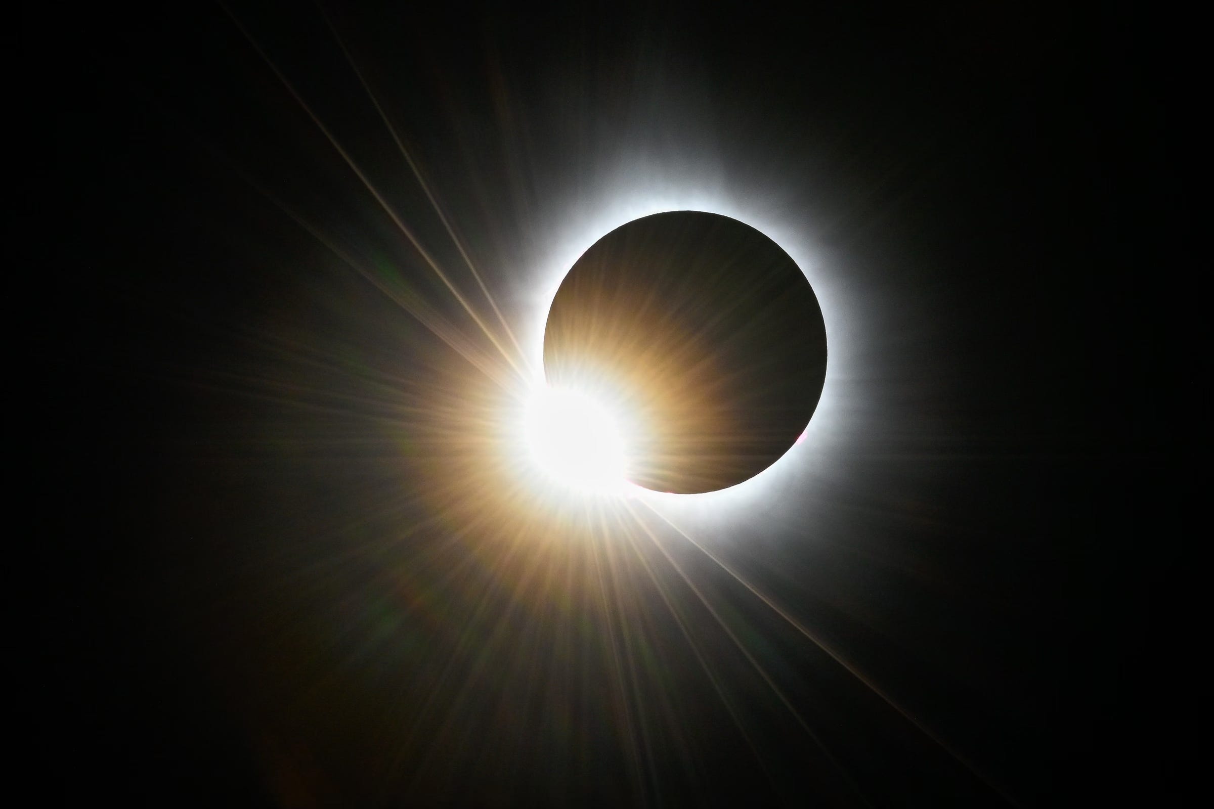 Baily's beads are seen as sunlight shines through mountains and valleys on the moon during the total solar eclipse as seen from Lancaster, NH, Monday, April 8, 2024.