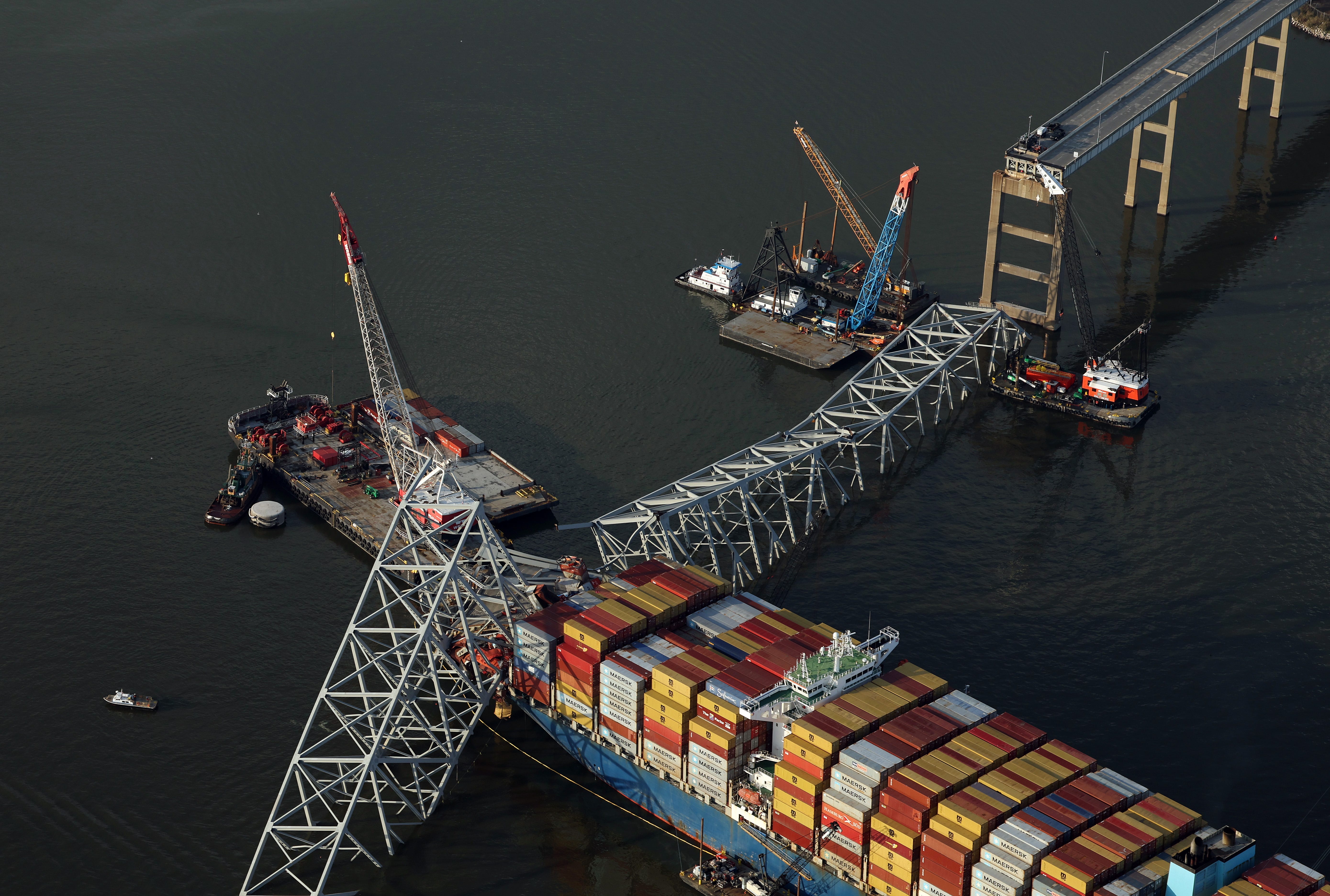 In an aerial view, salvage crews continue to remove wreckage from the cargo ship Dali after it stuck and collapsed the Francis Scott Key Bridge in the Baltimore Harbor on April 09, 2024 in Baltimore, Maryland. The Unified Command has started removing containers from the Dali while also working to clear the channel to restore the flow of commerce to the Port of Baltimore. The bridge collapsed after being struck by the 984-foot cargo ship Dali at 1:30 AM on March   26.