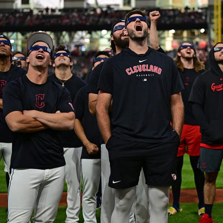 April 8: Players for the Cleveland Guardians watch a total solar eclipse before a game against the Chicago White Sox at Progressive Field.