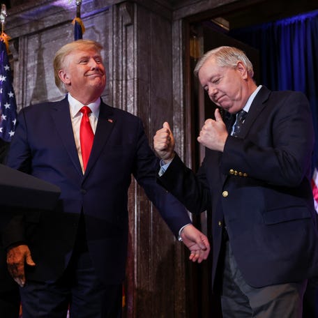 U.S. Senator Lindsey Graham (R-SC) gives former President Donald Trump the thumbs-up during campaign stop at the South Carolina State House in Columbia, South Carolina, U.S., January 28, 2023.