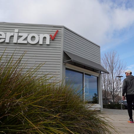 A person walks by a Verizon store on January 23, 2024 in Corte Madera, California.