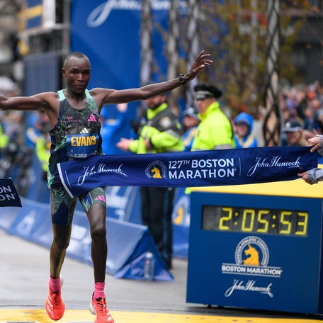 Evans Chebet of Kenya crosses the finish line to win the men's division at then 2023 Boston Marathon on April 17, 2023.