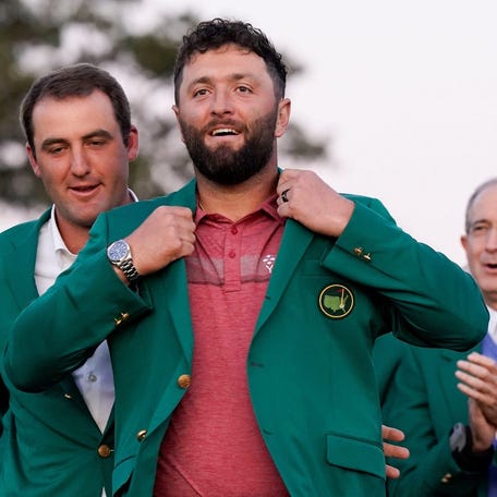Jon Rahm puts on the traditional Green Jacket after winning the 2023 Masters in Augusta, Georgia.