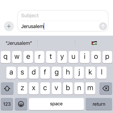 Screenshot of iPhone English (UK) keyboard suggesting Palestinian flag with the word 'Jerusalem.' The company has said it is a bug that will be fixed in the next update.
