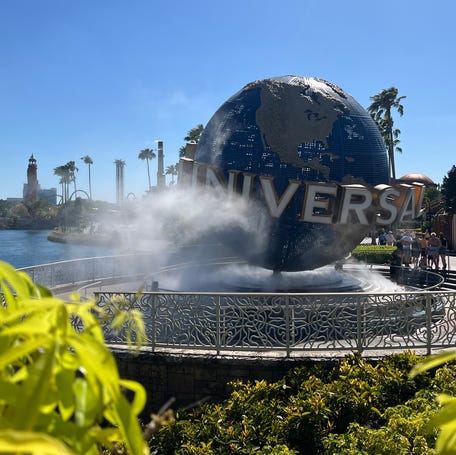 Universal Studios' iconic globe spins outside of Universal Studios Florida.