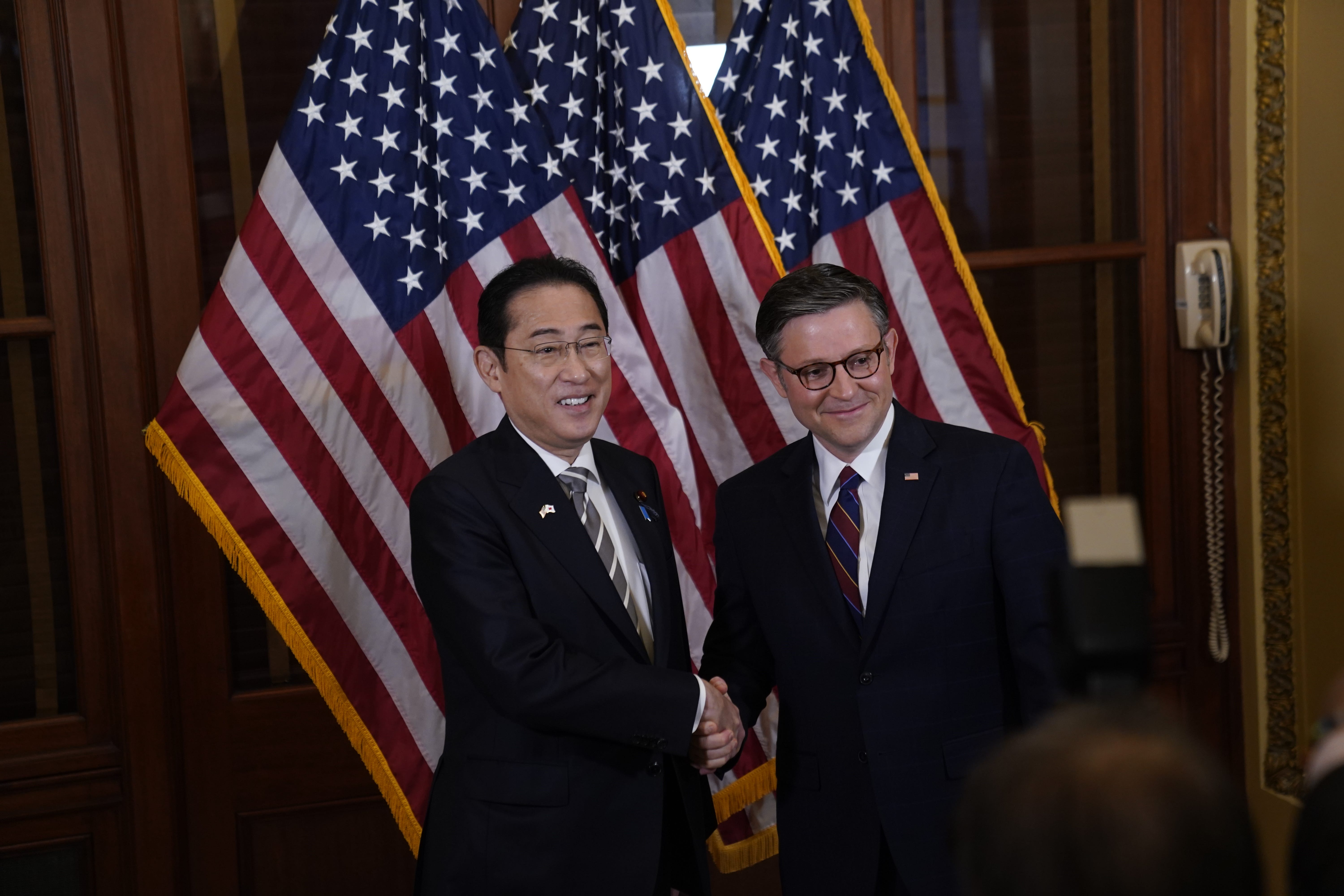 House speaker Mike Johnson, right, greets Japanese Prime Minister Fumio Kishida on April 11, 2024. Kishida will address Congress in Washington, D.C., on Thursday.