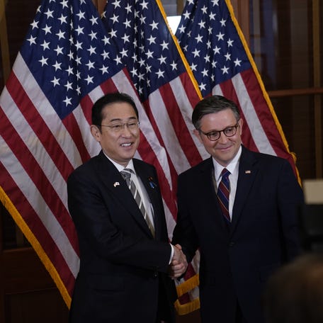 House speaker Mike Johnson, right, greets Japanese Prime Minister Fumio Kishida on April 11, 2024. Kishida will address Congress in Washington, D.C., on Thursday.