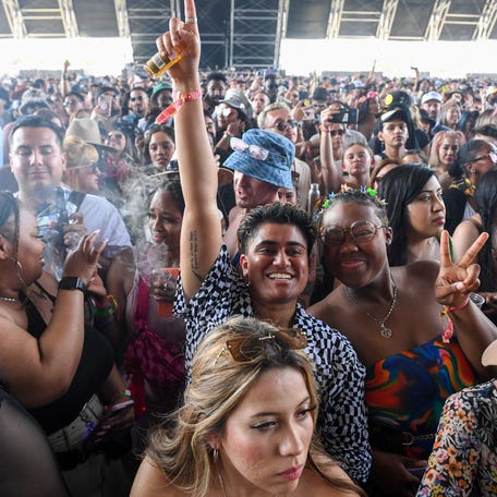 Fans of US rapper Latto wait for the start of her performance on the first weekend of the Coachella Valley Music and Arts Festival in Indio, California, on April 16, 2023. (Photo by VALERIE MACON / AFP) (Photo by VALERIE MACON/AFP via Getty Images)