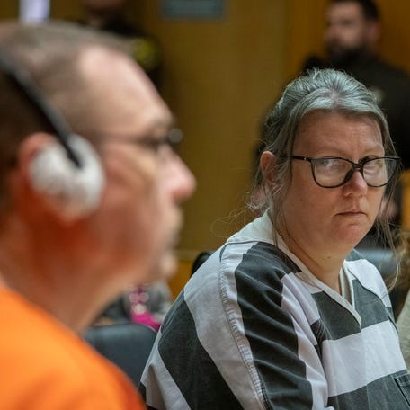 PONTIAC, MICHIGAN - APRIL 9: Jennifer Crumbley looks at her husband James Crumbley during their sentencing on four counts of involuntary manslaughter for the deaths of four Oxford High School students by their son, mass school shooter Ethan Crumbley, on April 9, 2024 at Oakland County Circuit Court in Pontiac, Michigan. Jennifer and James Crumbley are the first parents in U.S. history to be criminally tried and convicted for a mass school shooting that was   committed by their child.