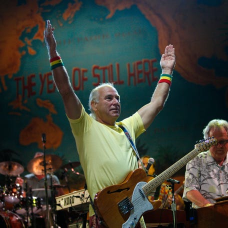 Jimmy Buffett and the Coral Reefer Band perform at the Cynthia Mitchell Woods Pavilion in Houston, Texas.