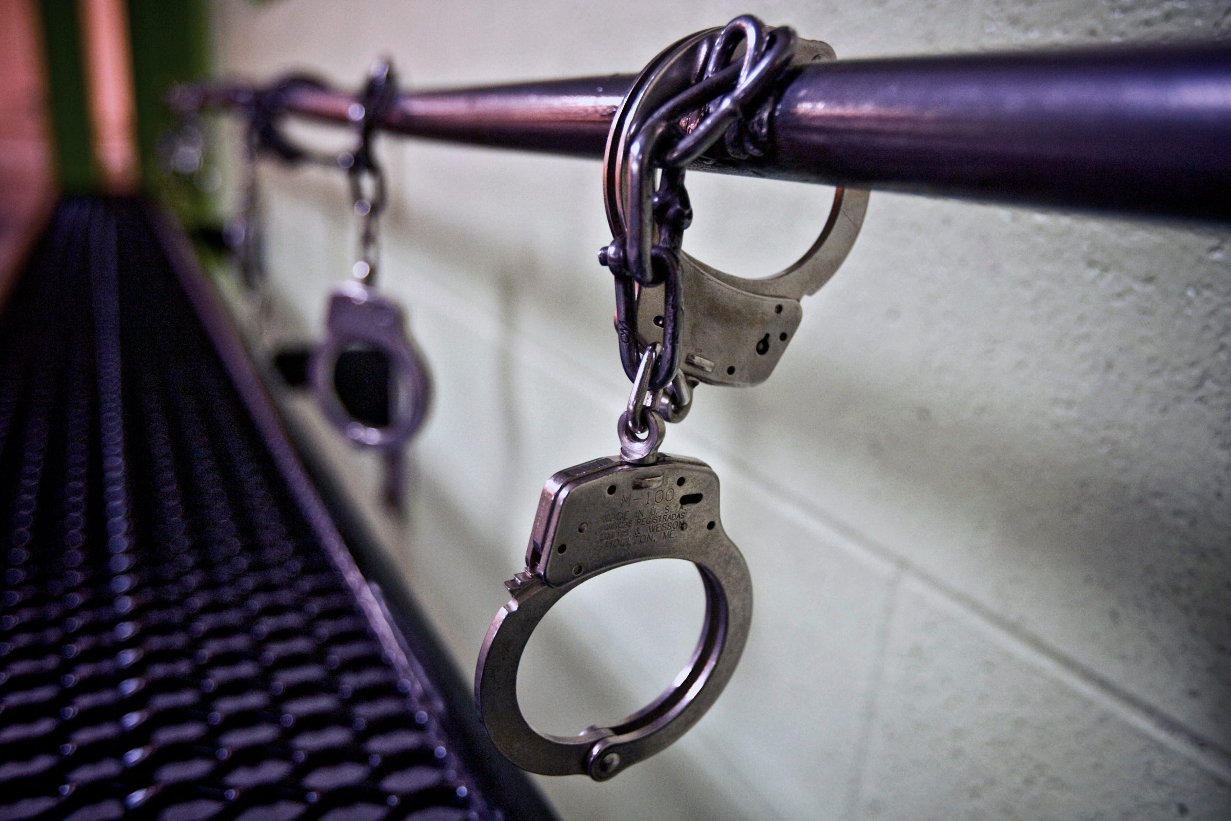 Pictured are Handcuffs attached to a security bar at the Oklahoma County jail.