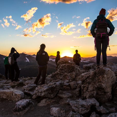 Visitors watch the sunset near Rocky Mountain National Park's Alpine Visitor Center.