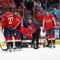 Washington Capitals' Nick Jensen leaves game on stretcher after being shoved into boards