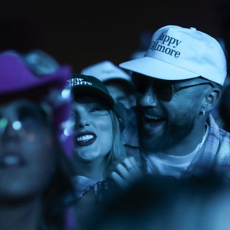 Taylor Swift and Travis KeIce watch as Ice Spice performs in the Sahara tent at the Coachella Valley Music and Arts Festival in Indio, Calif., April 13, 2024.