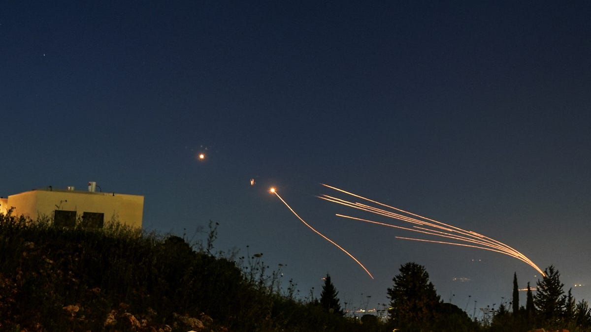 Israel's Iron Dome anti-missile system intercepts rockets launched from Lebanon towards Israel over the Israeli Lebanese border, on April 12, 2024.